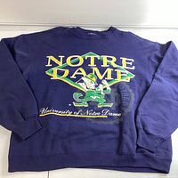 Front view of the blue Notre Dame sweatshirt with mid-sized graphic of mascot and text.