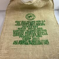 Front side of burlap sack with text from Volcafe Peru S.A. identifying origin and product details
