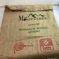 Front side of the burlap sack showing Monte Verde coffee branding with green and red text