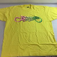 Front view of yellow T-shirt with 'Jamboree In The Hills' logo centered on chest.