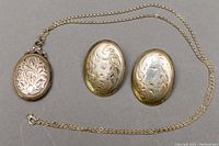 Photo of 925 silver necklace with oval locket and pair of matching oval clip-on earrings, showing overall items and chain length.