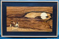 Full front view of framed wood inlay art showing canoe scene under moon