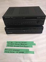 Front view of stacked receiver and CD player with handwritten note