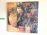 Front view of the square floral wall art print featuring vibrant garden pots and flowers.