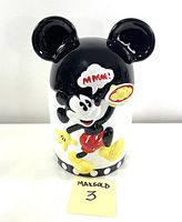 Front view of the vintage ceramic Mickey Mouse cookie jar showing the character in color and the speech bubble 'MMMM!'