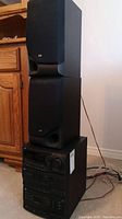 Full view of stacked JVC MX-C220 stereo system with two bookshelf speakers on top.