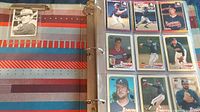 Open binder page with 9 baseball cards featuring Atlanta Braves players.