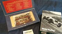 Boxed Queen Maudlin Tram Company tram car model next to a boxed set of Motor Racing greeting cards.