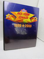 Front cover of the purple Kraft All-Star Collection binder for 1999-2000 season with logo and year printed on front