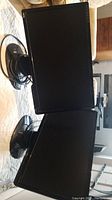 Pair of 26-inch Benq Senseye Photo computer monitors with stands and cables, placed on a table with a light-colored cloth.