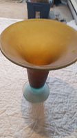 Side view of the hand blown glass vase showing the color gradient and shape