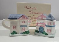 Front angled view of the ceramic sugar bowl and creamer set with original box in the background