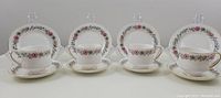 Four complete Paragon Belinda tea trios arranged in a row showing cups, saucers, and side plates
