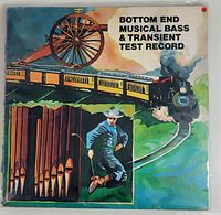 Single vintage record album titled Bottom End Musical Bass & Transient Test Record with illustrated cover featuring a steam train, large wheel, and man jumping.