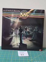 Front cover of Atlanta Rhythm Section vinyl LP titled 'A Rock and Roll Alternative' shows band performing on stage with colorful horizontal stripes and logo.