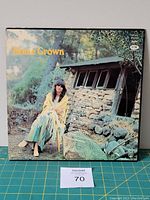 Album cover of Home Grown by Linda Ronstadt in outdoor setting with rustic cabin