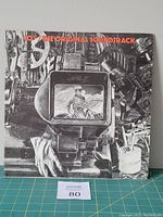 Front cover of 10cc The Original Soundtrack Vinyl LP showing stylized camera and film equipment illustration with a screen image of person on horseback.