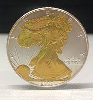 Obverse straight-on view showing gold plated Walking Liberty design and date