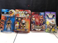 Five WWF/WWE wrestling action figures in packaging, including Chyna WrestleMania Series 9, Road Rager Summer Slam 1999, Championship Showdown Ripley vs Flair, Goldberg figure with weapon.