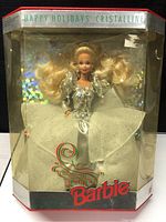 Front view of Barbie Happy Holidays Crystalline doll inside original clear plastic window box with holiday holographic background and red Barbie logo on lower front.