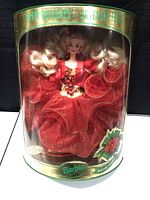 Barbie Happy Holidays Special Edition doll in original display packaging showcasing the full doll and dress.