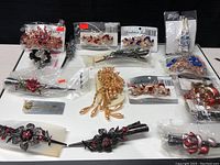 Full lot of hair clips arranged on a white surface showing various designs and colors