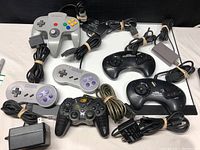 All controllers and power supply arranged showing variety and cables tied.