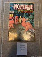 Front cover of Marvel Wolverine #11 comic book showing main characters and title.