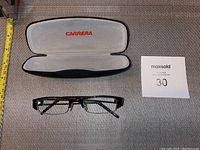 Black Carrera reading glasses with rectangular lenses and gold detailing.
