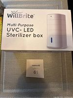 Closed retail box showing the WillBrite Multi-Purpose UVC LED Sterilizer Box branding and an image of the sterilizer unit itself.