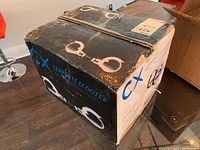 Box exterior with CX branding and scooter image.