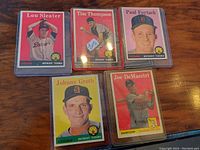 Front view of five 1950s Detroit Tigers baseball cards featuring Lou Sleater, Tim Thompson, Paul Foytack, Johnny Groth, and Joe DeMaestri.