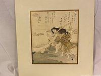 Full view of the framed woodblock print showing the woman fishing and surrounding calligraphy.