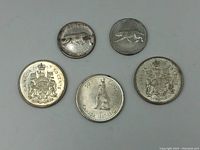 Top view of all five coins showing obverse and reverse details.