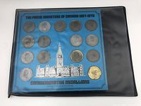 Blue card displaying 18 commemorative medallions honoring Canadian Prime Ministers from 1867 to 1970, with Parliament building illustration.