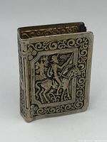 Front view showing Don Quixote on horseback holding a lance with elaborate border design.