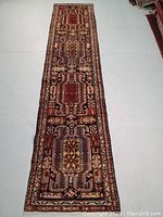 Full-length view of runner rug laid flat on floor showing entire pattern
