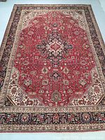 Overhead view of the full rug showing central medallion, borders, and field pattern