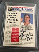 Front of the Upper Deck 1995 NHLPA Rookie Headliners trading card showing Brent Gretzky's image, player news styled text, and autograph in black ink.