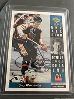 Front of Gary Roberts 1993 NHL All Star hockey card signed by Gary Roberts in blue ink.