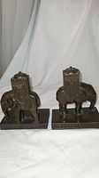 Pair of bronze elephant bookends side by side showing overall shape and size.