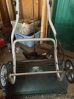 Front view of the Yardworks electric snow thrower showing the handle and wheels.