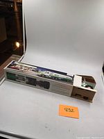 Hess Gasoline tanker truck in original box on plain white background with orange lot number card 852