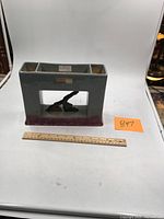 Front view of the glazed Roseville Artwood vase or planter showing mold number 1055-9 and overall color and shape.