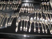 Overview of all flatware pieces laid out, showing the variety and quantity included.