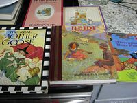 Five children's books arranged side by side on a surface showcasing their titles and colorful illustrated covers.
