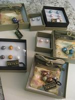 Multiple pairs of Honora pearl stud earrings in branded boxes and silky fabric pouches, all new and unused.