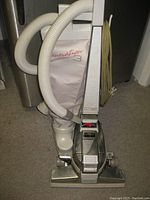 Full view of Kirby Generation 3 upright vacuum cleaner showing the main body, hose, and power cord wound on the back.