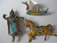Photo of all three brooches - gondola, horse, and man with detailed enamel color and sterling silver finish