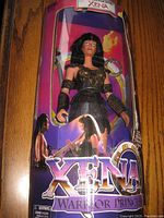 Full view of unopened Xena Warrior Princess 12 inch doll in original packaging with branding visible.